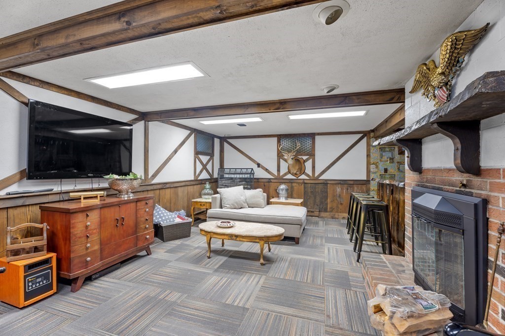 6 Oxford Road Hampstead, NH 03841 - Photo 24 of 32 a living room with furniture and a flat screen tv
