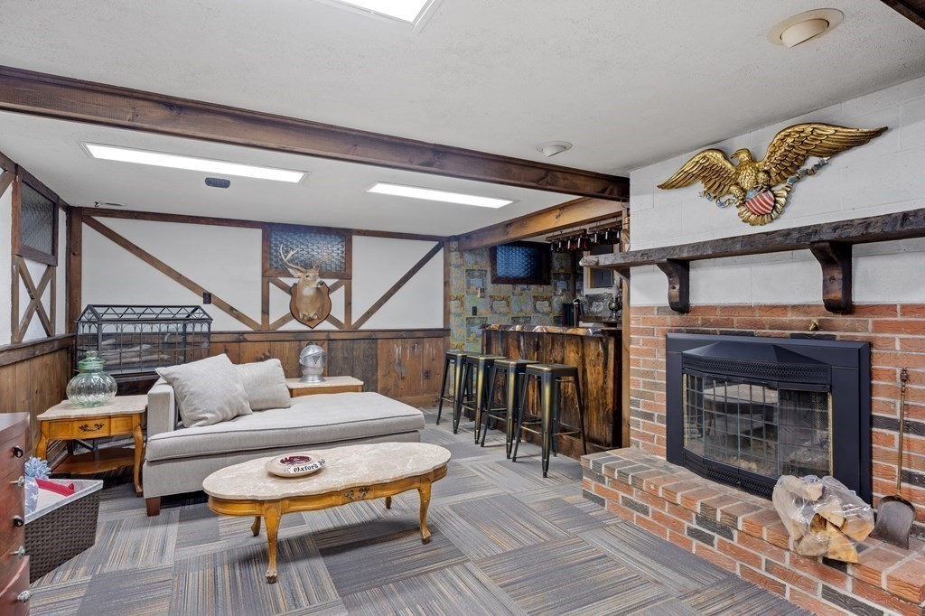 6 Oxford Road Hampstead, NH 03841 - Photo 25 of 32 a living room with furniture and a fireplace