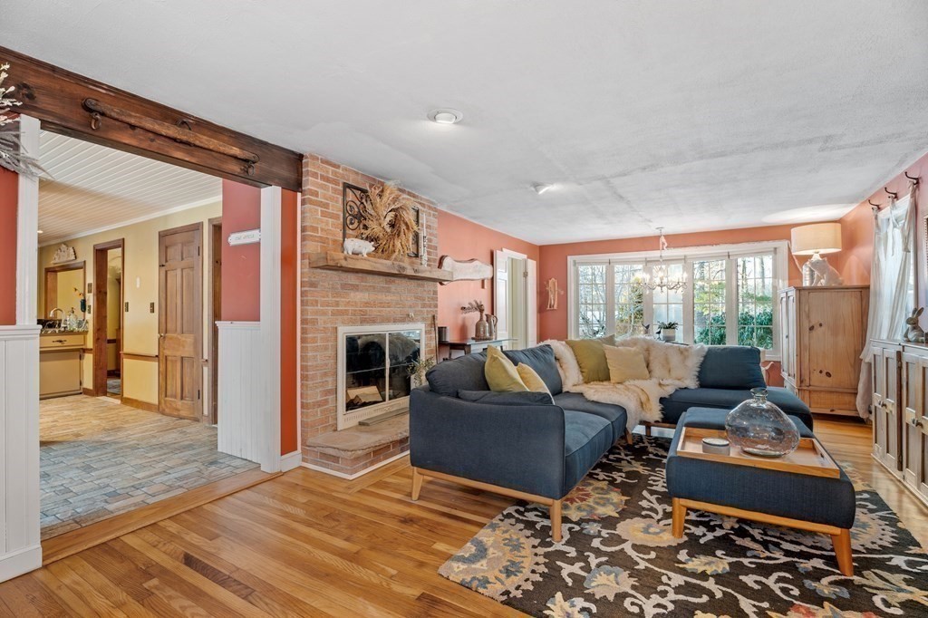6 Oxford Road Hampstead, NH 03841 - Photo 5 of 32 a living room with furniture and a fireplace