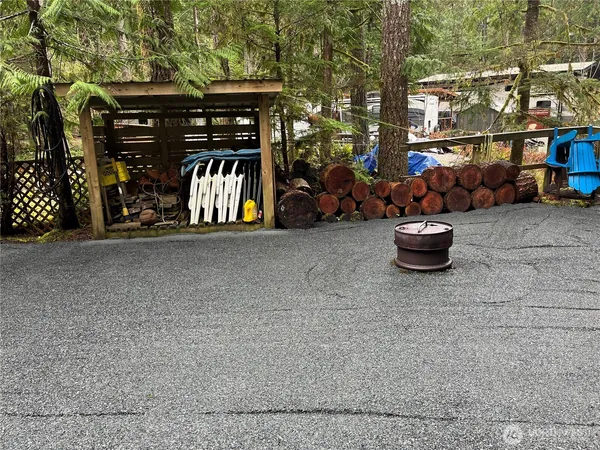 a view of outdoor space with lots of trees in the background