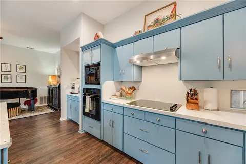 a bathroom with a double vanity sink window and a mirror