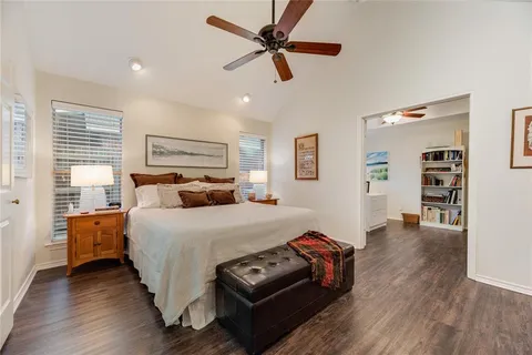 a bed room with a bed and a view of closet