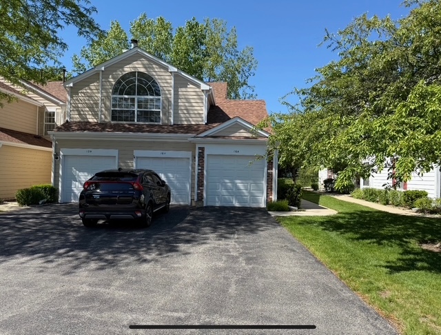 16 Tyler Court, Unit B Streamwood, IL 60107 - Photo 1 of 20 a car parked in front of a house