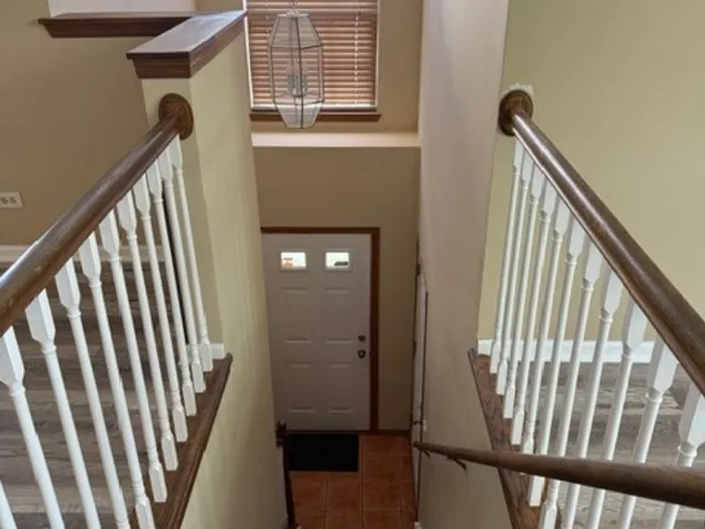 a view of balcony with wooden floor