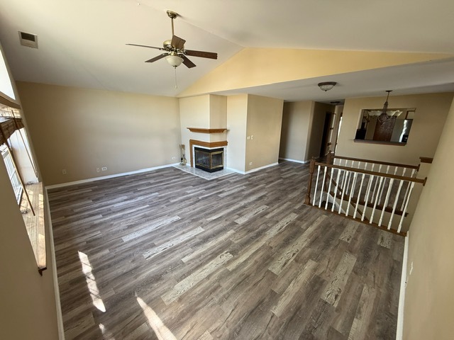 16 Tyler Court, Unit B Streamwood, IL 60107 - Photo 4 of 20 a view of livingroom with furniture and staircase