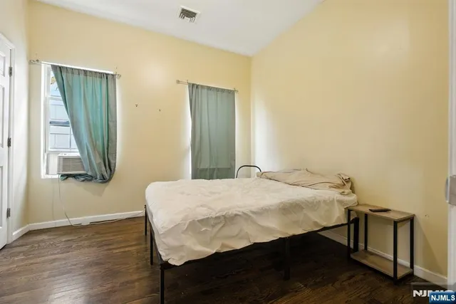 a bedroom with a bed and a table