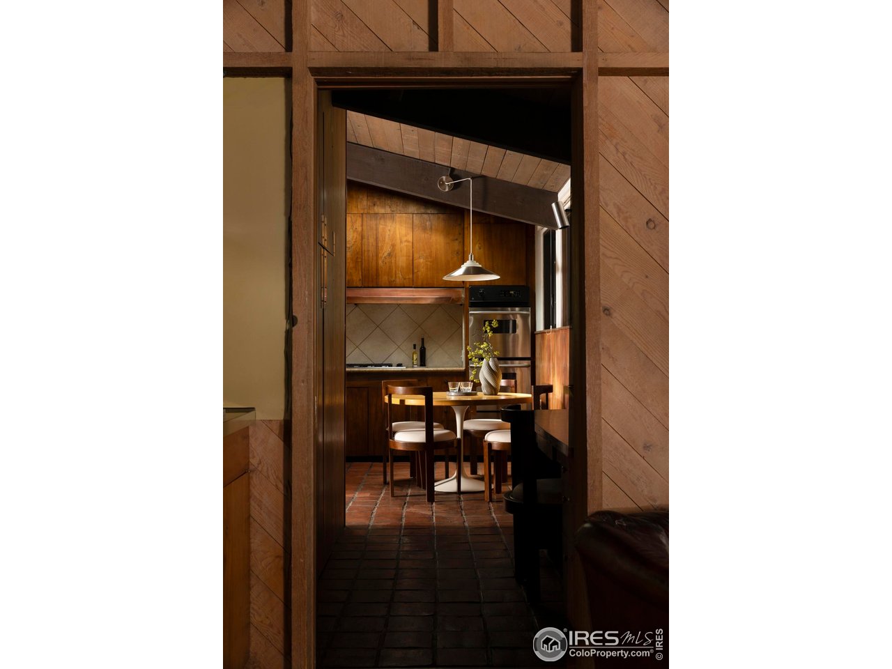 705 Willowbrook Road Boulder, CO 80302 - Photo 12 of 34 a picture of a room with a dining table and chairs