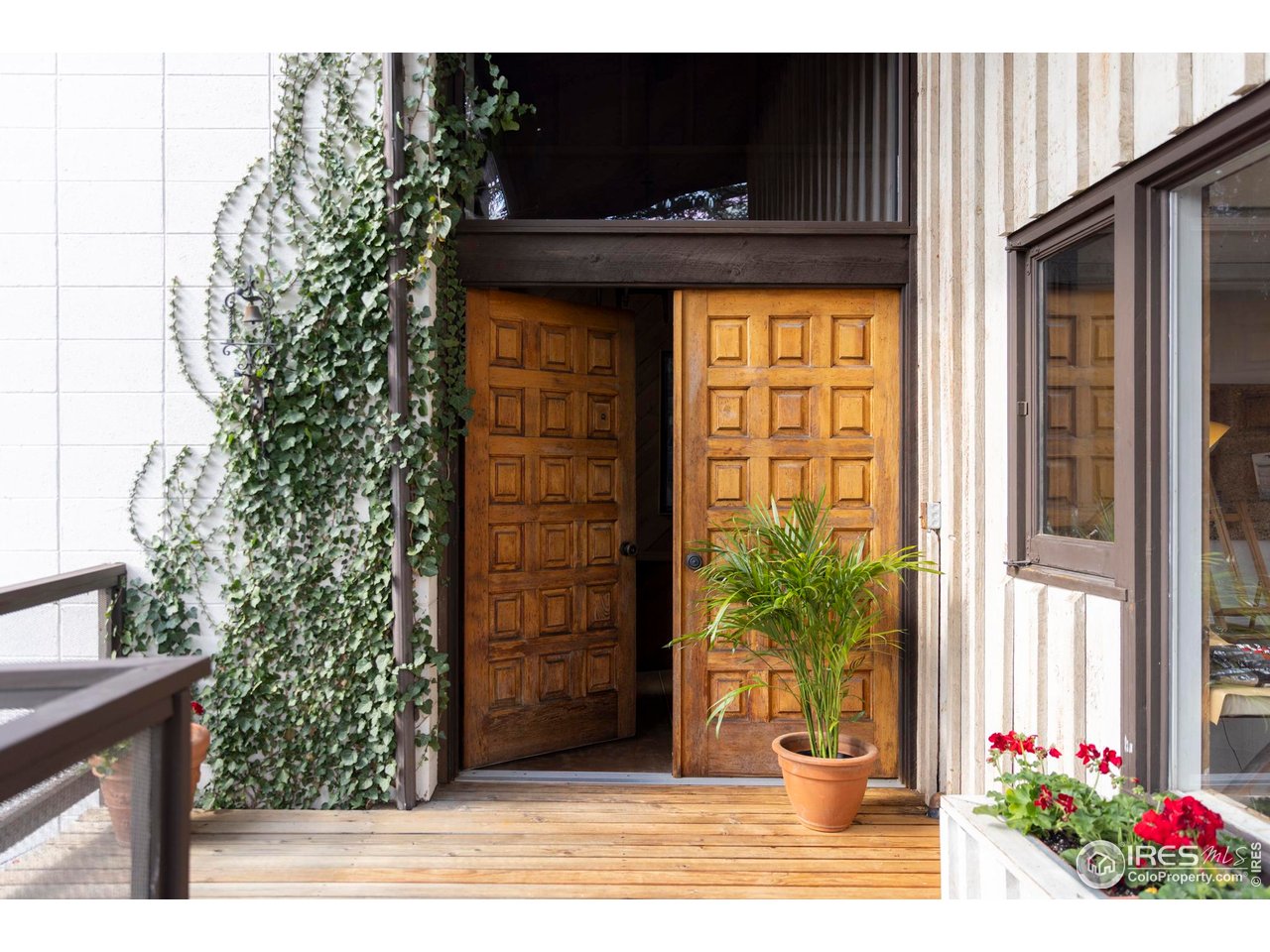 705 Willowbrook Road Boulder, CO 80302 - Photo 4 of 34 a potted plant sitting in front of a house