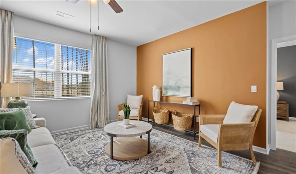 205 Storm Lane Hoschton, GA 30548 - Photo 17 of 51 a living room with furniture and a window