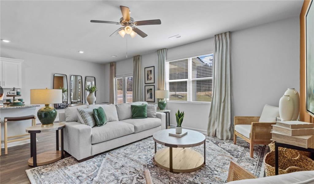 205 Storm Lane Hoschton, GA 30548 - Photo 18 of 51 a living room with furniture and a potted plant
