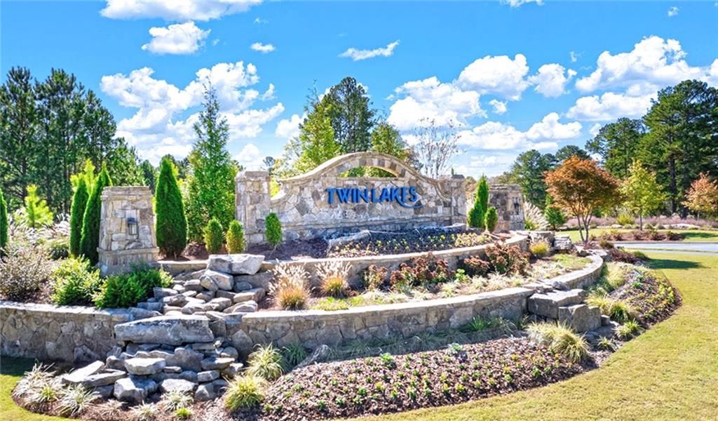 205 Storm Lane Hoschton, GA 30548 - Photo 2 of 51 a view of a garden with flowers