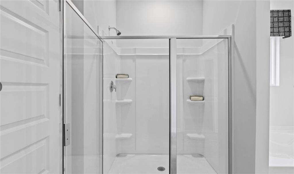 205 Storm Lane Hoschton, GA 30548 - Photo 27 of 51 a bathroom with a shower