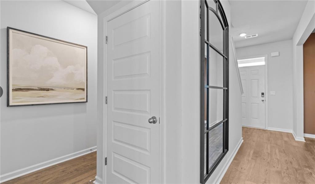 205 Storm Lane Hoschton, GA 30548 - Photo 28 of 51 a view of hallway with wooden floor