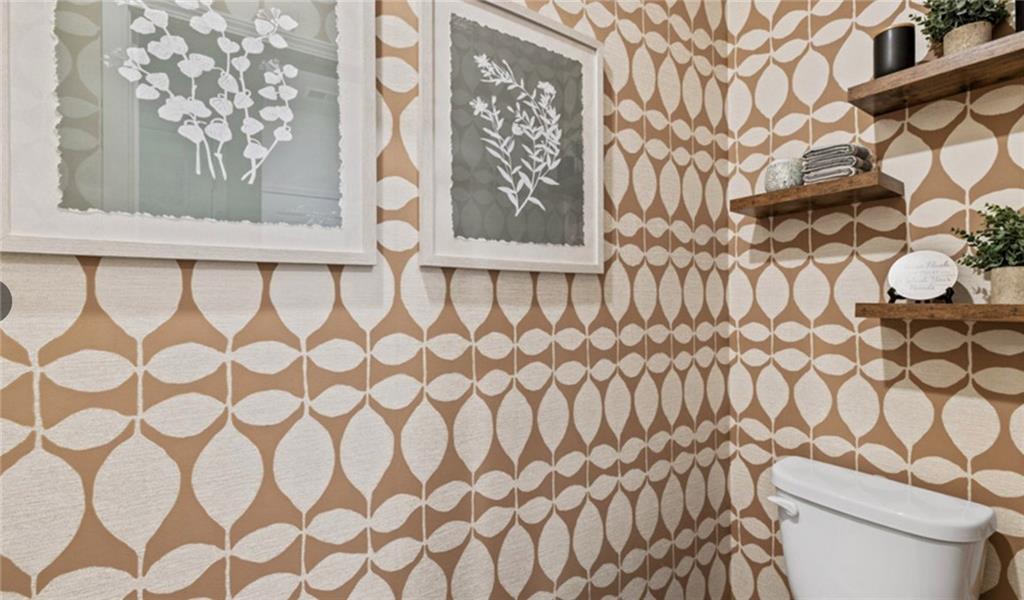 205 Storm Lane Hoschton, GA 30548 - Photo 29 of 51 a white toilet sitting next to a white curtain