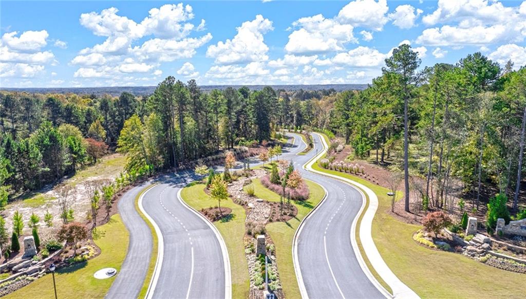 205 Storm Lane Hoschton, GA 30548 - Photo 3 of 51 a view of a swimming pool with seating area