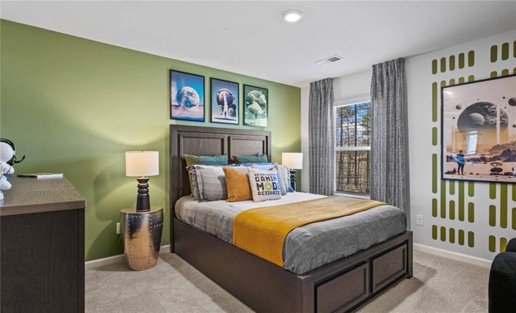 205 Storm Lane Hoschton, GA 30548 - Photo 40 of 51 a bedroom with a bed and a window