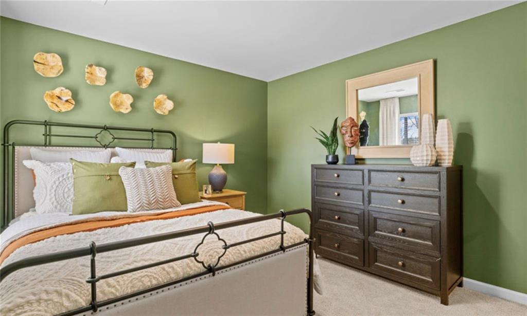 205 Storm Lane Hoschton, GA 30548 - Photo 43 of 51 a bedroom with a bed and a dresser