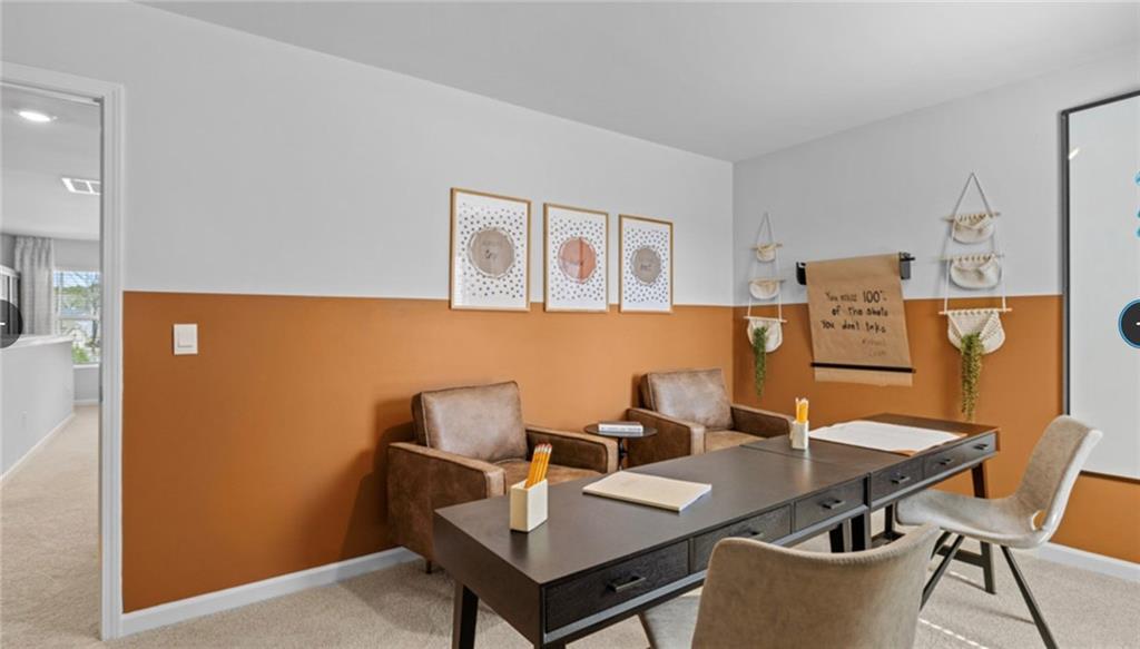 205 Storm Lane Hoschton, GA 30548 - Photo 46 of 51 a view of a dining room with furniture and wooden floor