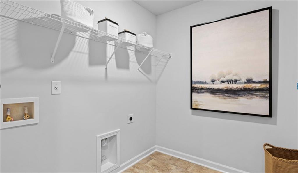 205 Storm Lane Hoschton, GA 30548 - Photo 47 of 51 a view of a room that has a painting on the wall