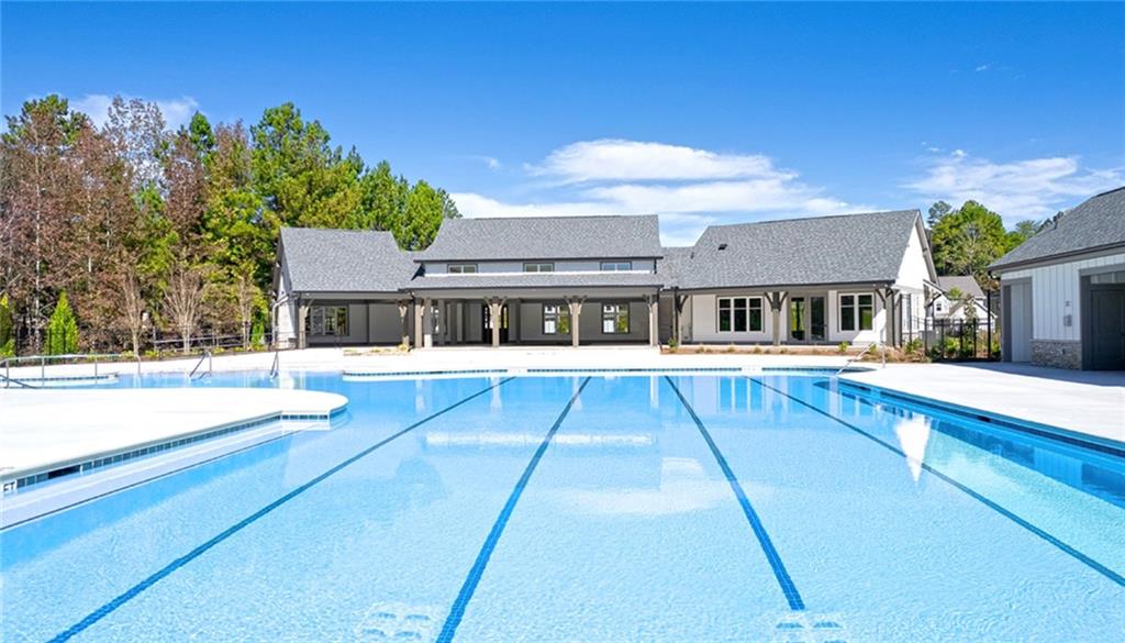 205 Storm Lane Hoschton, GA 30548 - Photo 5 of 51 a view of house with a swimming pool