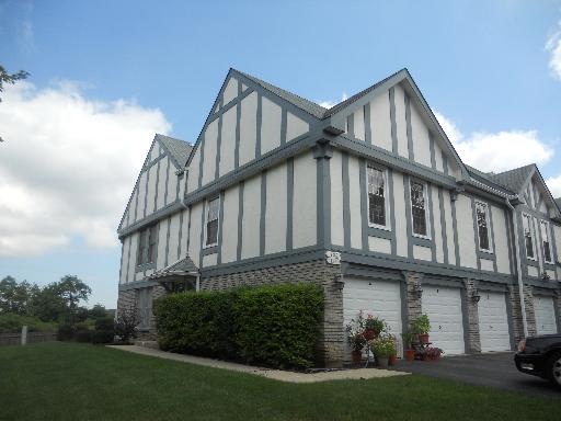 126 West Golf Road, Unit C Libertyville, IL 60048 - Photo 2 of 21 a view of a house with brick walls and plants