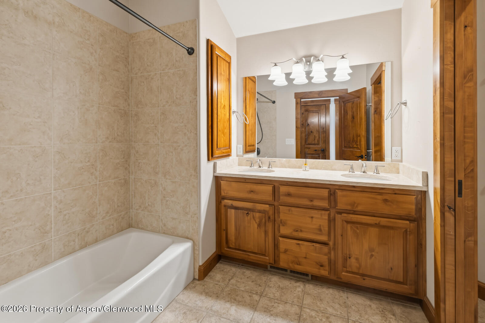 316 Faas Ranch Road New Castle, CO 81647 - Photo 31 of 50 a bathroom with a tub a sink and a large mirror