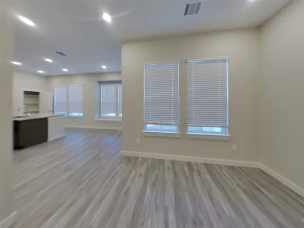 a view of a kitchen with a sink and a microwave