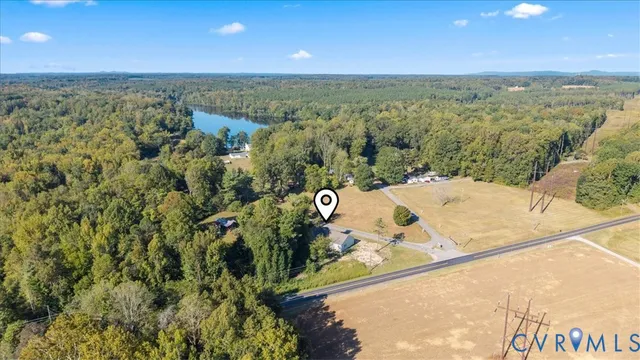 a view of a house with a yard and sitting area