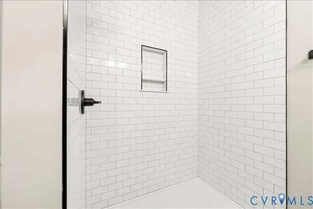 a bathroom with a granite countertop sink a toilet and bathtub