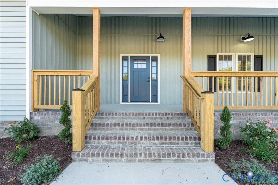 7 Trices Lake Road Columbia, VA 23038 - Photo 5 of 44 a front view of a house with a garden