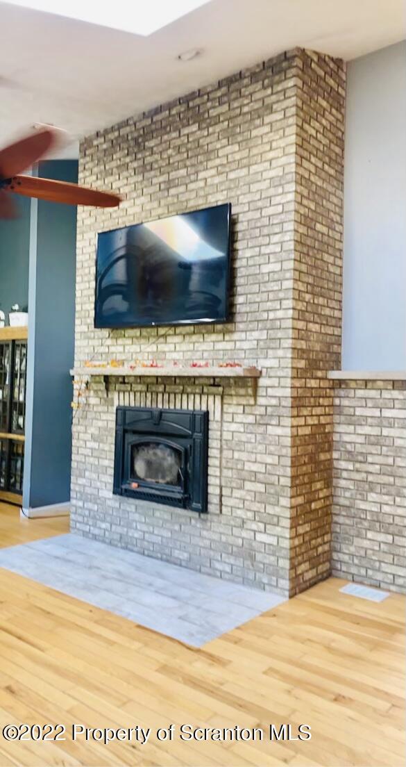 915 Line Road Lake Ariel, PA 18436 - Photo 14 of 17 a living room with a fireplace and a flat screen tv