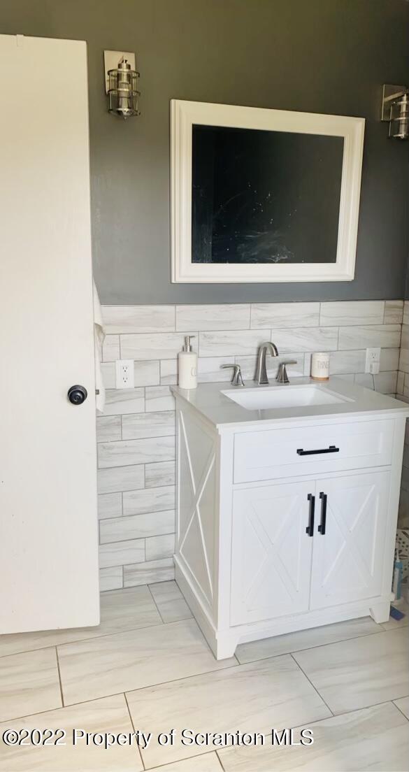 915 Line Road Lake Ariel, PA 18436 - Photo 8 of 17 a bathroom with a sink and a mirror