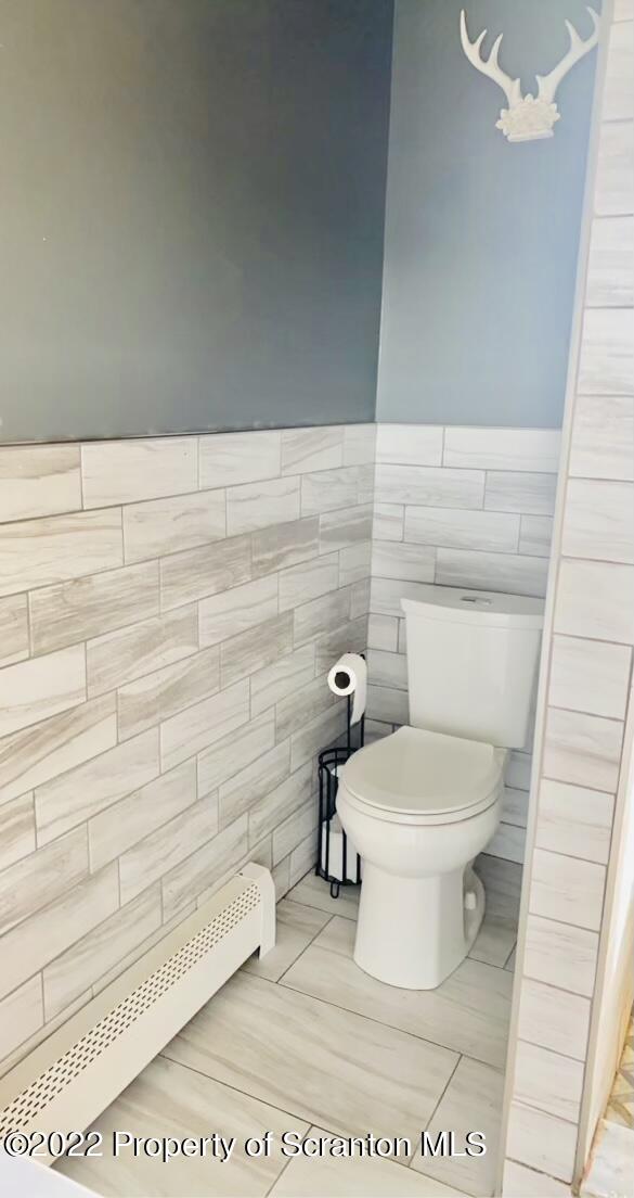 915 Line Road Lake Ariel, PA 18436 - Photo 10 of 17 a white toilet sitting next to a shower