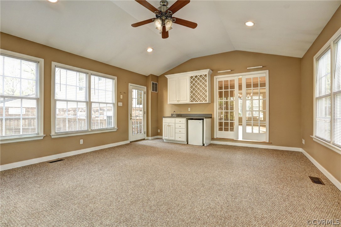 1519 Village Grove Road Henrico, VA 23238 - Photo 12 of 36 a view of an empty room with a window and a kitchen