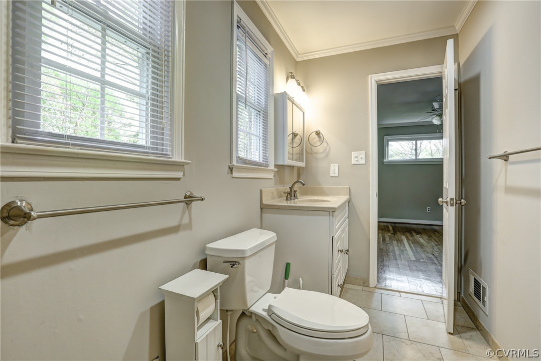 1519 Village Grove Road Henrico, VA 23238 - Photo 20 of 36 a bathroom with a toilet a sink and a window