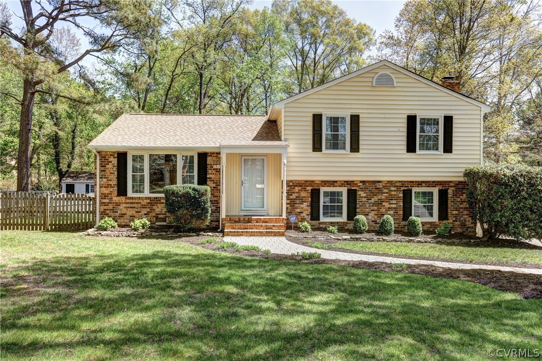 1519 Village Grove Road Henrico, VA 23238 - Photo 2 of 36 a front view of a house with a yard