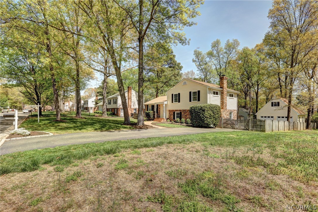 1519 Village Grove Road Henrico, VA 23238 - Photo 25 of 36 a front view of a house with a yard