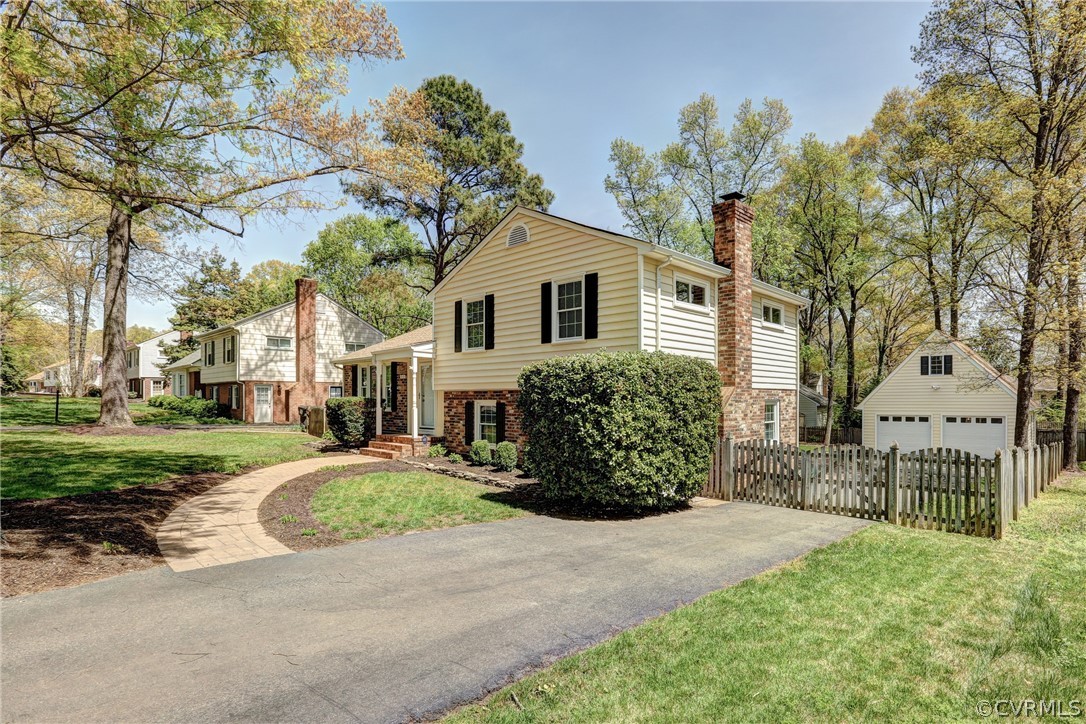 1519 Village Grove Road Henrico, VA 23238 - Photo 27 of 36 a front view of a house with a garden