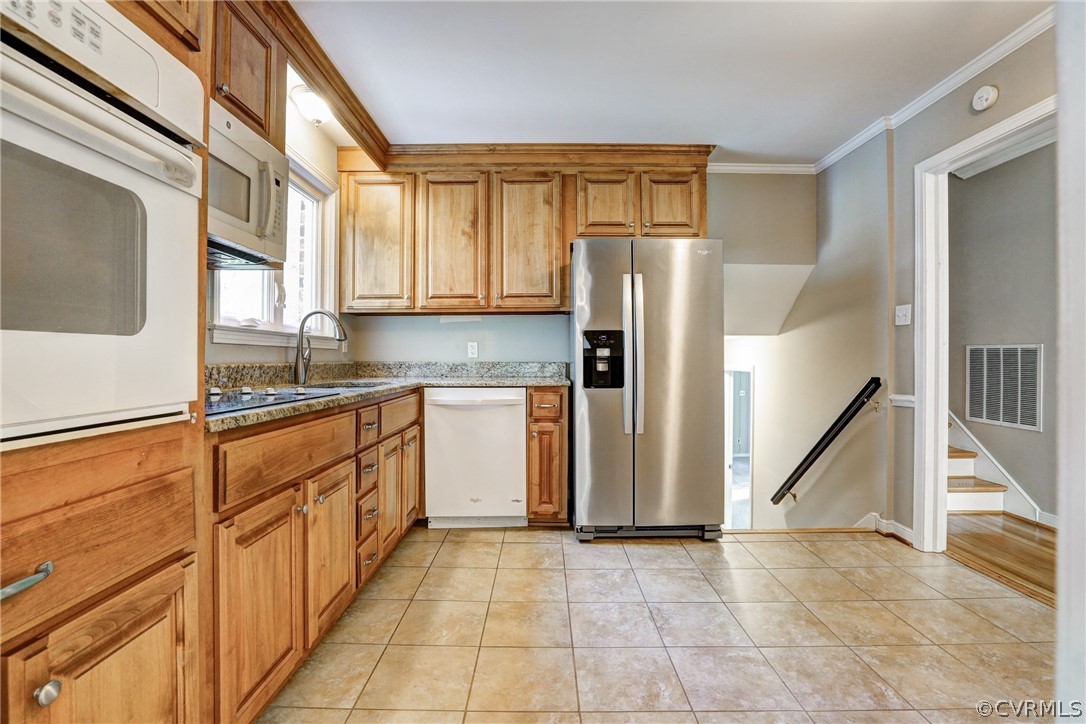 1519 Village Grove Road Henrico, VA 23238 - Photo 3 of 36 a kitchen with stainless steel appliances granite countertop a refrigerator and a stove top oven