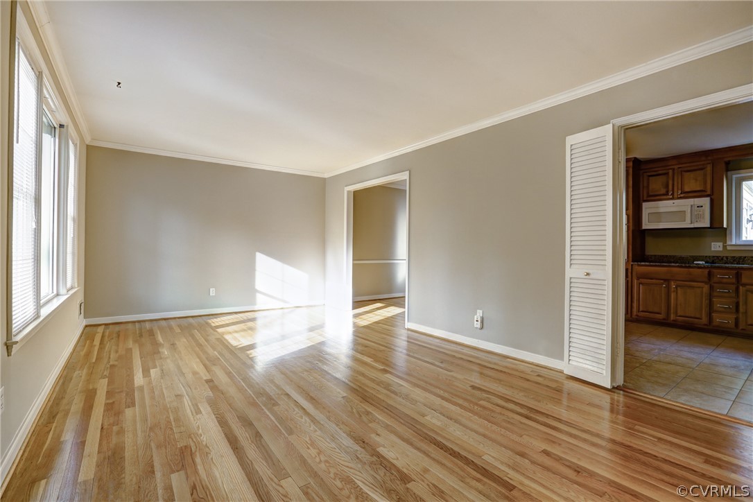 1519 Village Grove Road Henrico, VA 23238 - Photo 4 of 36 wooden floor in an empty room with a window