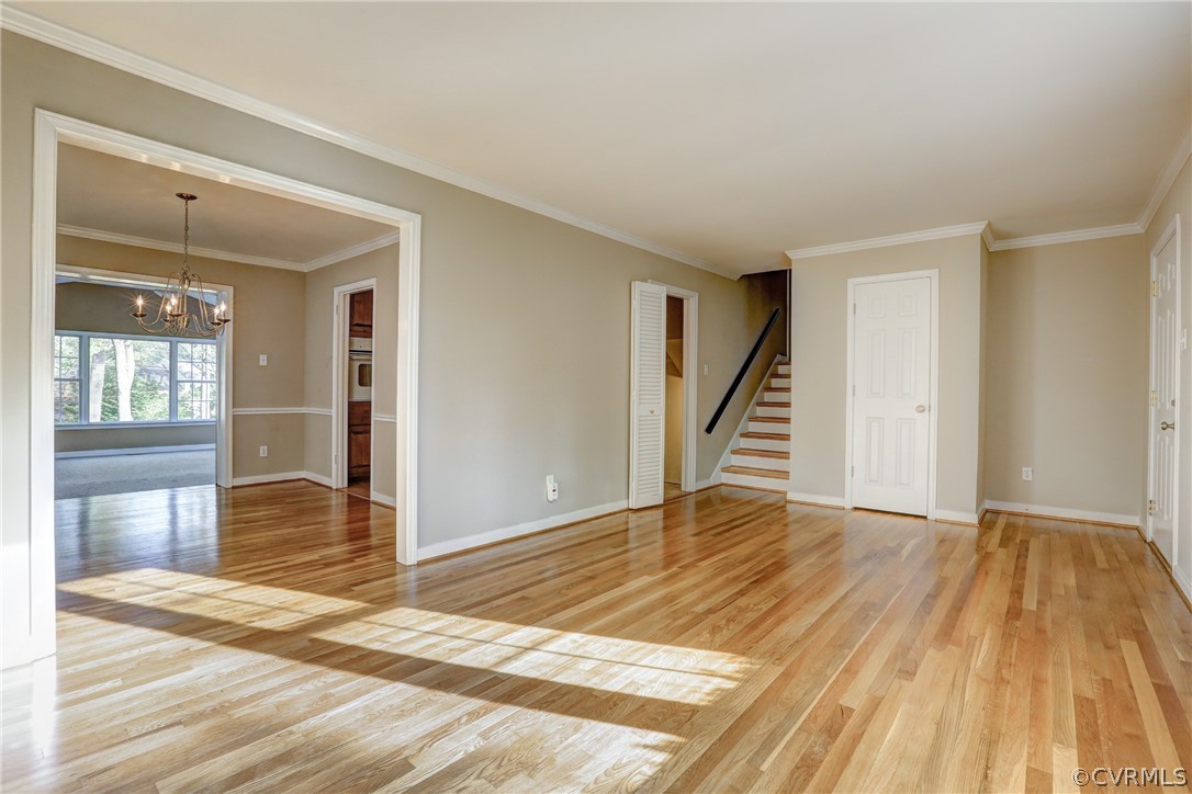 1519 Village Grove Road Henrico, VA 23238 - Photo 5 of 36 a view of an empty room with wooden floor and stairs