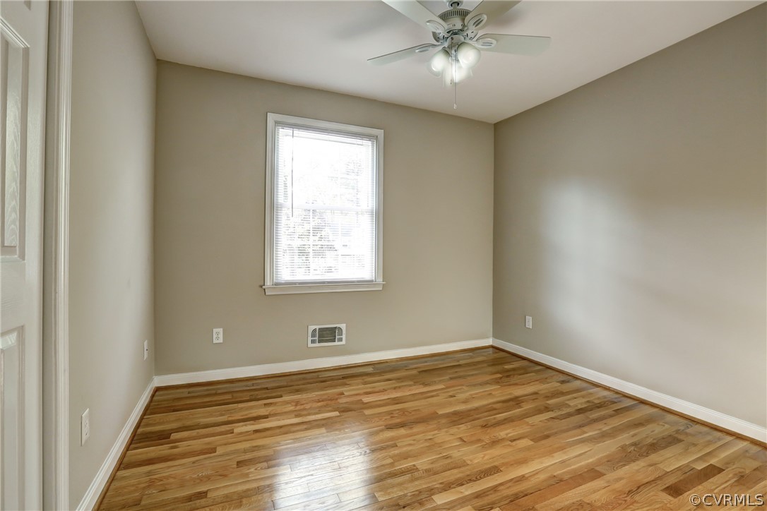 1519 Village Grove Road Henrico, VA 23238 - Photo 8 of 36 wooden floor in an empty room with a window