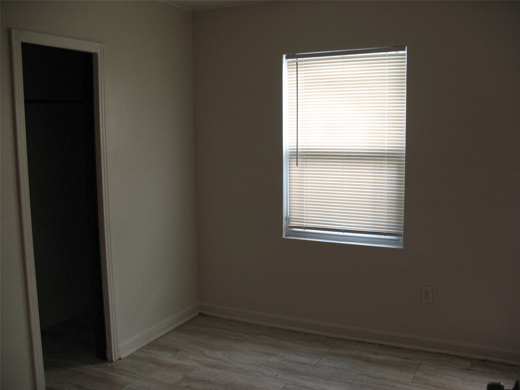 2610 Scott Street Houston, TX 77004 - Photo 8 of 11 a view of an empty room with wooden closet and a window