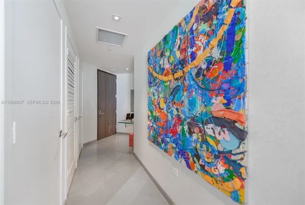 a very nice looking room with a small refrigerator