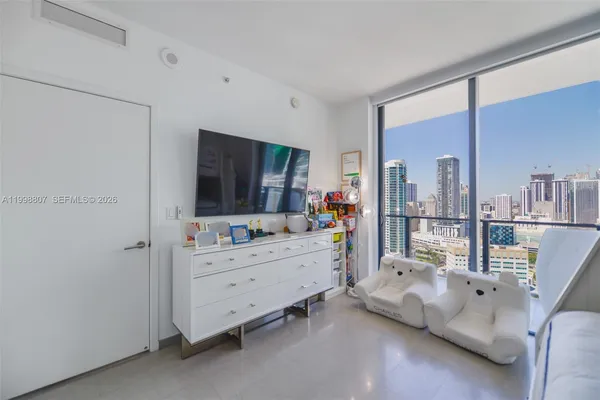 a room with furniture and a flat tv screen