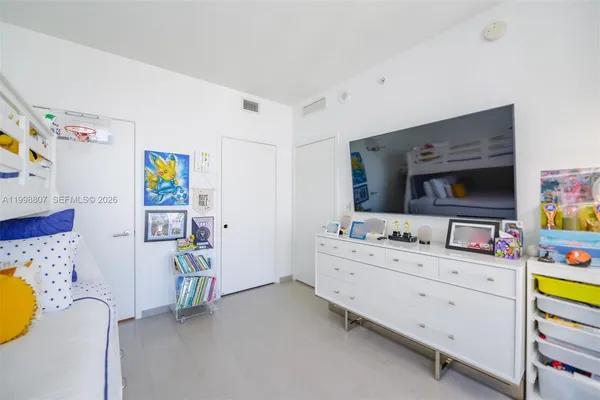 a bathroom with a sink mirror vanity and toilet