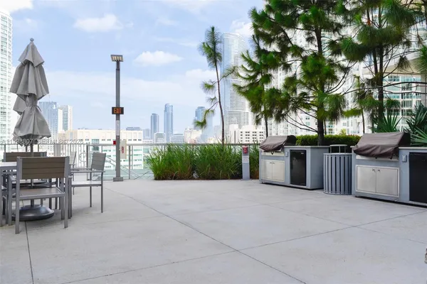 a view of a chairs and table in the patio