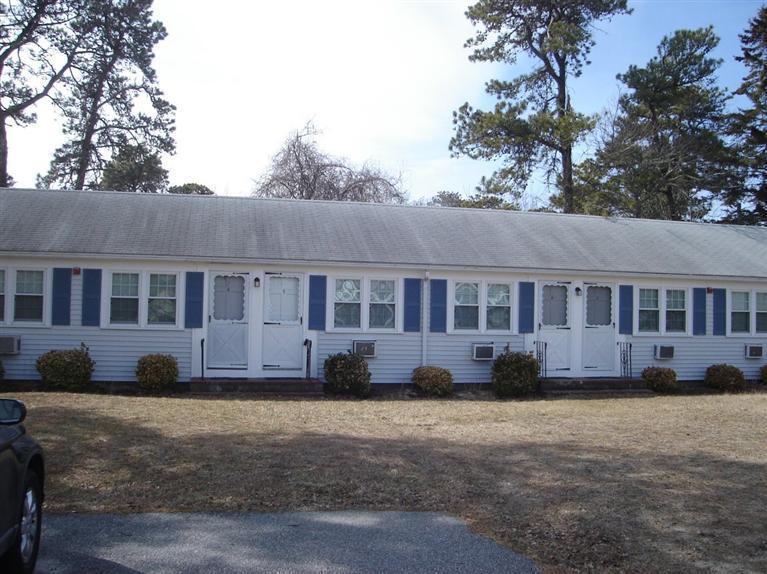 49 Lower County Road, Unit 16 Dennis Port, MA 02639 - Photo 11 of 12 a view of a house with a backyard