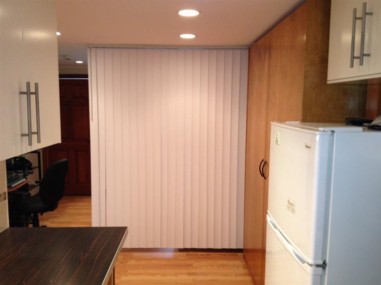 49 Lower County Road, Unit 16 Dennis Port, MA 02639 - Photo 3 of 12 a view of a kitchen with wooden floor and staircase