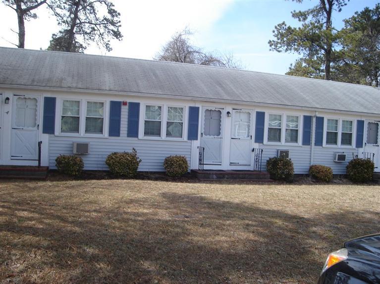 49 Lower County Road, Unit 16 Dennis Port, MA 02639 - Photo 10 of 12 a view of a house with a yard